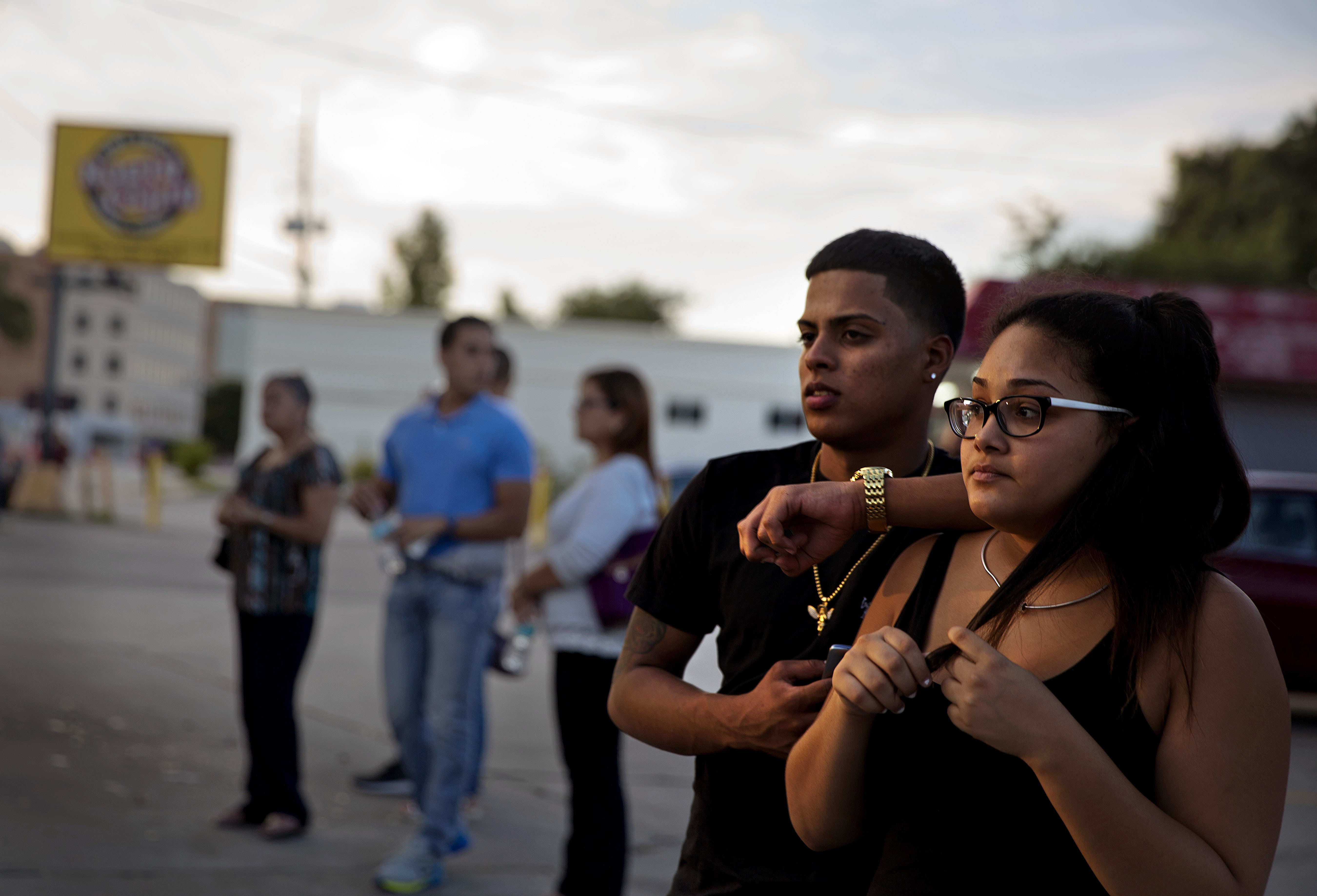 The Latest: 'We remember them': Victims' names read at vigil
