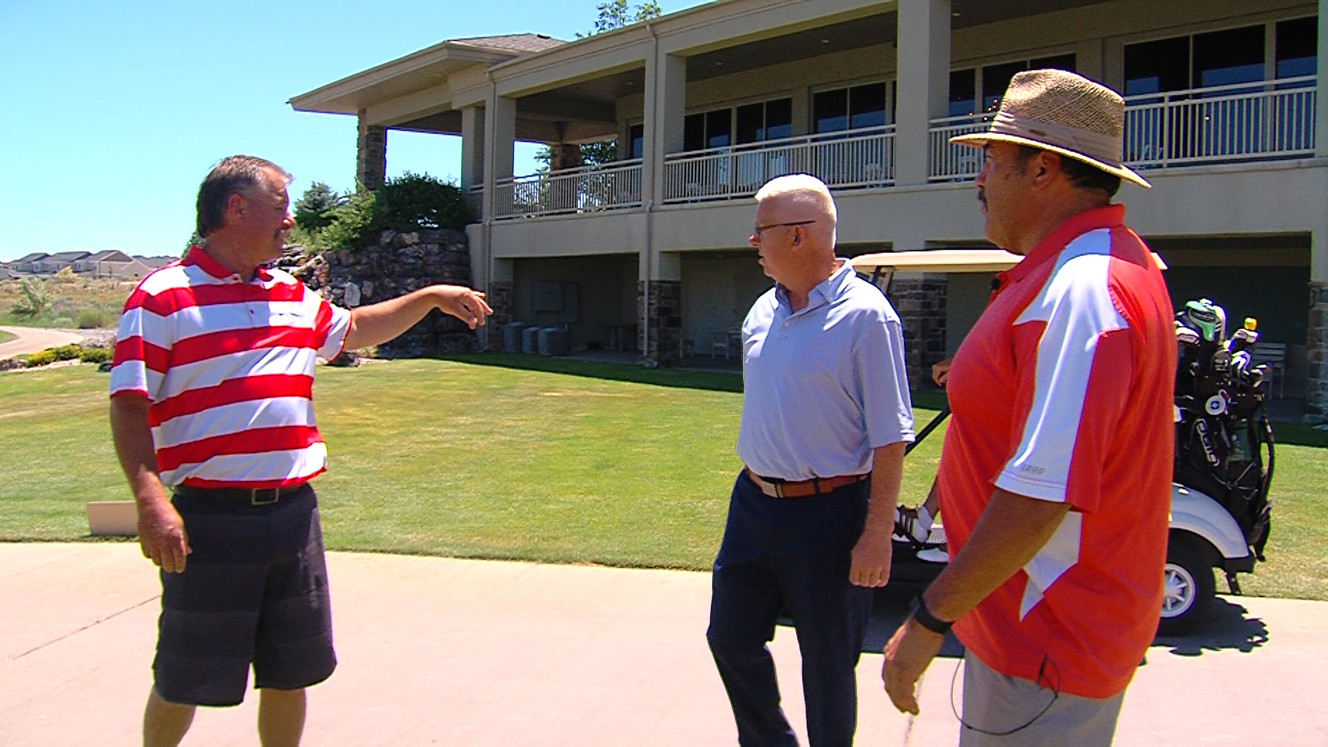 Orem fire captain Dave Hood, left, talks with Talons Cove general manager Steve Watts and Murray fire chief Gil Rodriguez. Hood was one of five first responders who helped save Watts' life last January. (Photo: Jeremiah Jensen, KSL-TV)