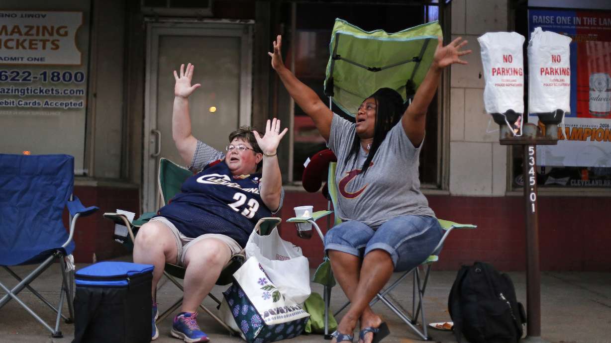 The Latest: 1 person shot after Cavs victory celebration