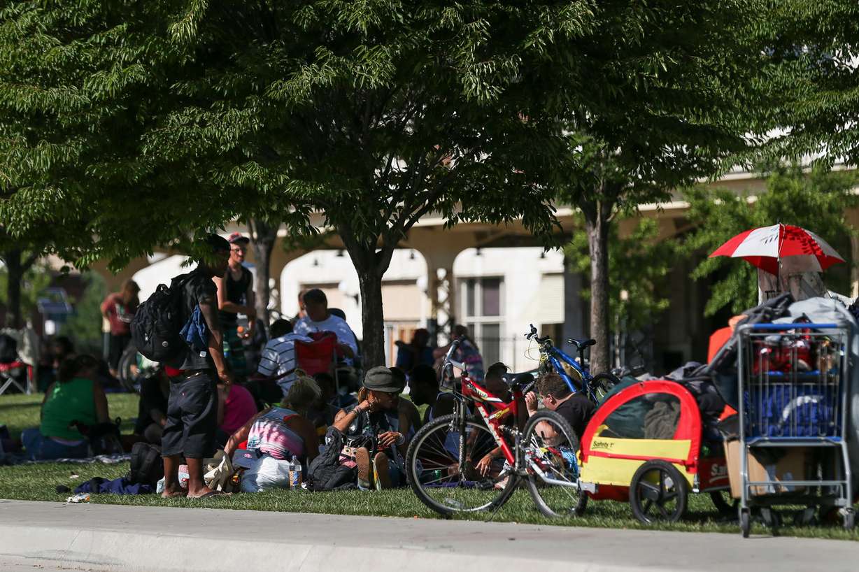 People walk along 500 West near the Rio Grande Depot in Salt Lake City on Wednesday, June 22, 2016. (Photo: Spenser Heaps, Deseret News)
