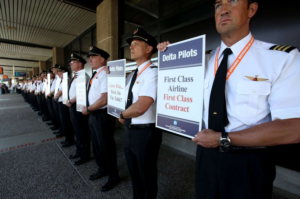 Delta Air Line pilots conduct informational picketing at the Delta terminal of the Salt Lake City International Airport on Friday, June 24, 2016, to raise the sense of urgency in the ongoing negotiations. Over five months have passed since the contract's amendable date. Fifteen months of negotiations have passed, and the Delta pilots are still awaiting a new agreement. (Photo: Laura Seitz, Deseret News)