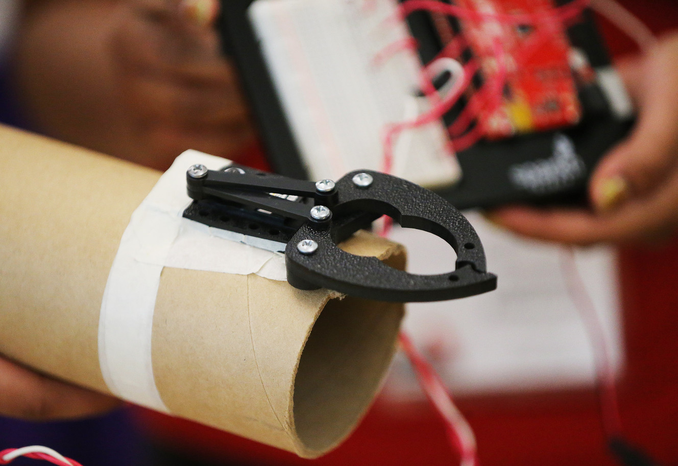 Northwest Middle School students and twin sisters Karina and Jasmine Rubalcava demonstrate their prosthetic arm prior to the national Mathematics, Engineering, Science Achievement competition at Weber State University in Ogden on Friday, June 24, 2016. (Photo: Jeffrey D. Allred, Deseret News)