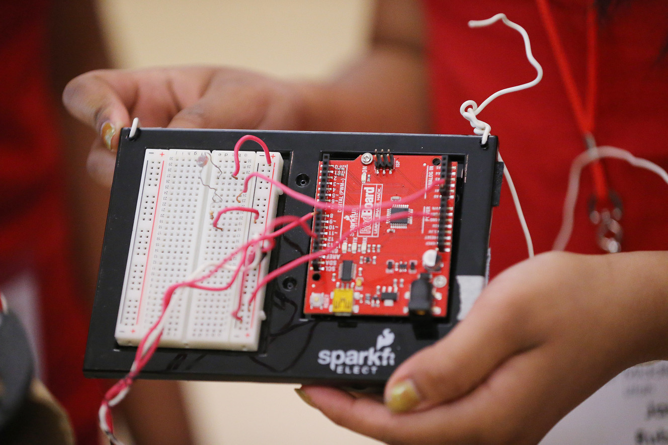 Northwest Middle School students and twin sisters Karina and Jasmine Rubalcava demonstrate their prosthetic arm prior to the national Mathematics, Engineering, Science Achievement competition at Weber State University in Ogden on Friday, June 24, 2016. (Photo: Jeffrey D. Allred, Deseret News)