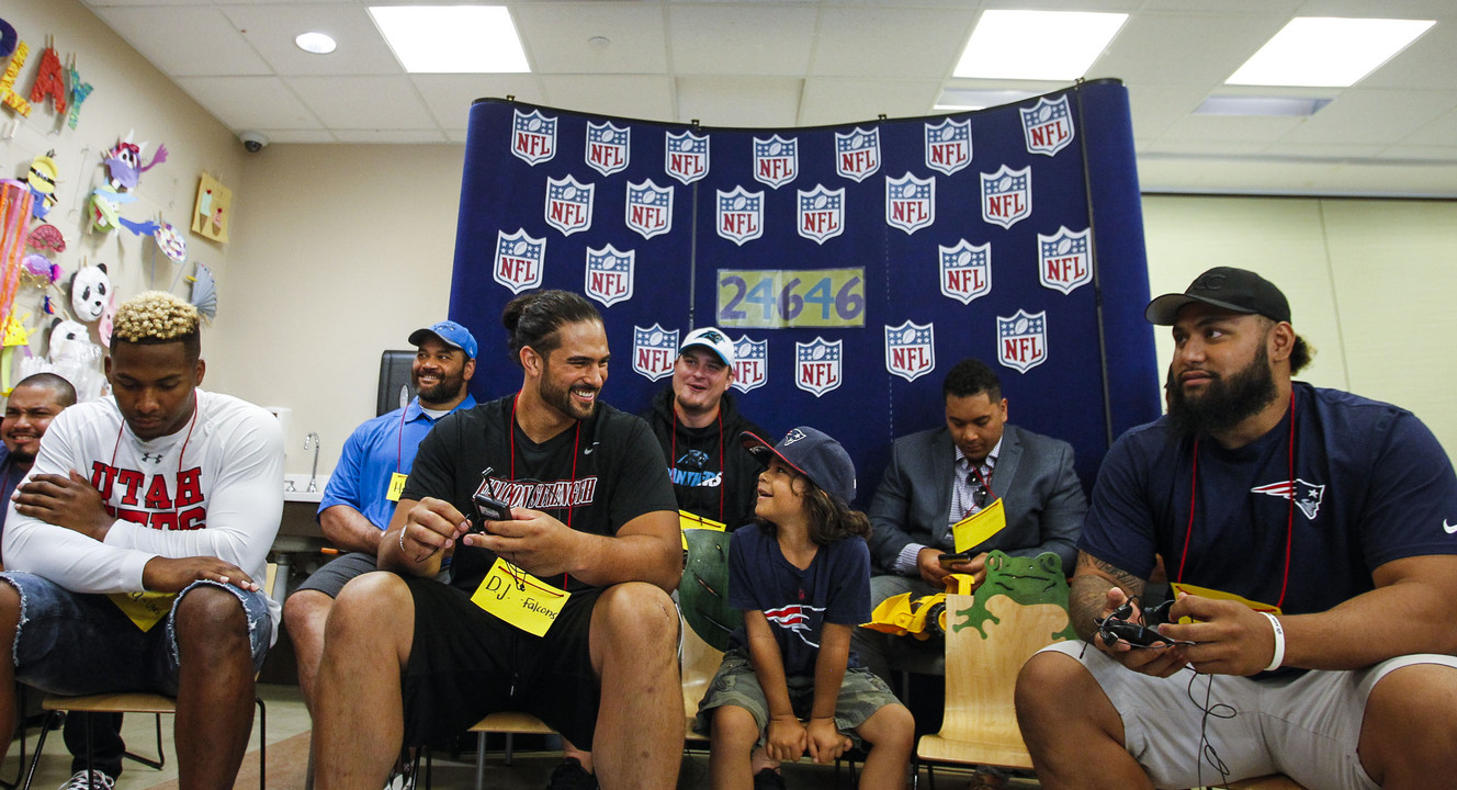 Atlanta Falcons' D.J. Tialavea, left, answers questions at an event where Utah-based players got to interact with patients at the Primary Children's Hospital in Salt Lake City on Friday, June 24, 2016. (Photo: Weston Kenney, Deseret News)