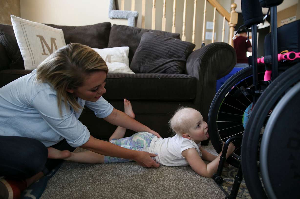 Brooklyn Morris, 4, plays with her preschool teacher, Paige Furbush, left, at Brooklyn's home in West Jordan on Thursday, June 23, 2016. Brooklyn Morris has a brain tumor, is mostly blind and suffers from other developmental delays. (Photo: Spenser Heaps, Deseret News)