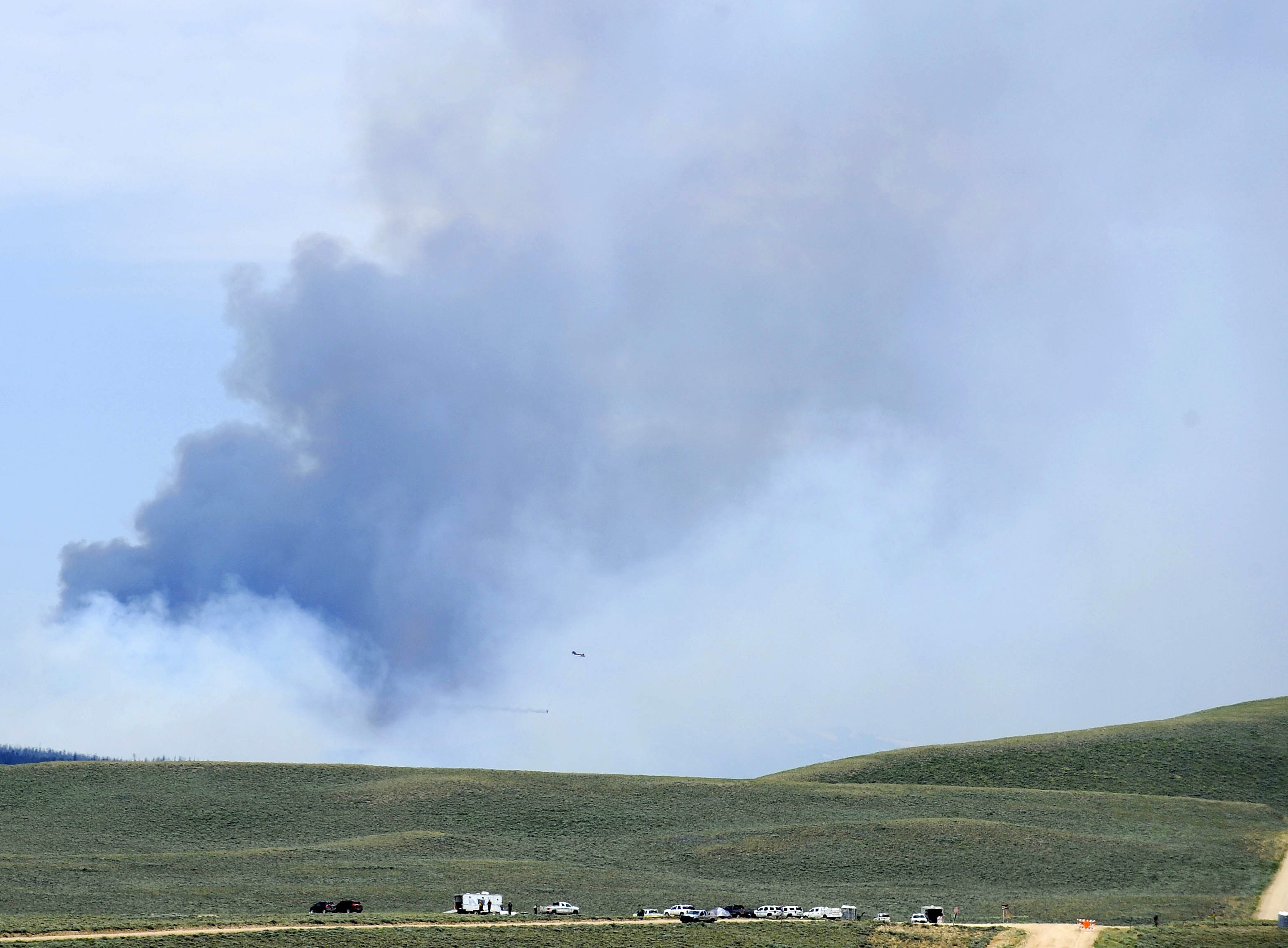 The Latest: Possible human remains found in wildfire