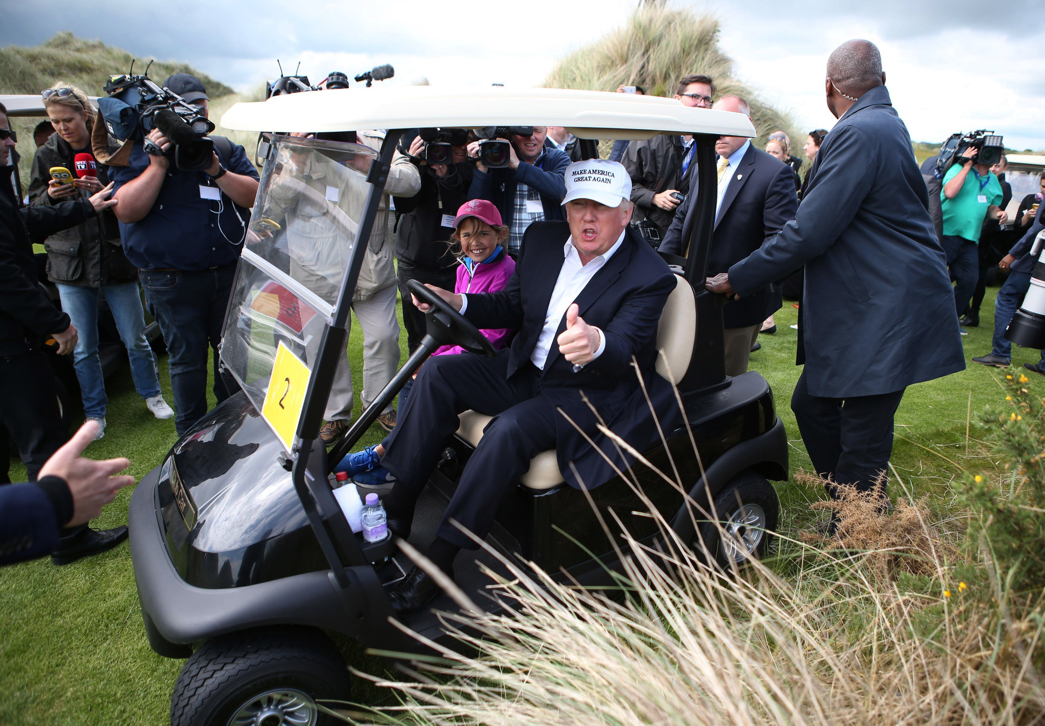 Business promotion and politics par for Trump's golf tour