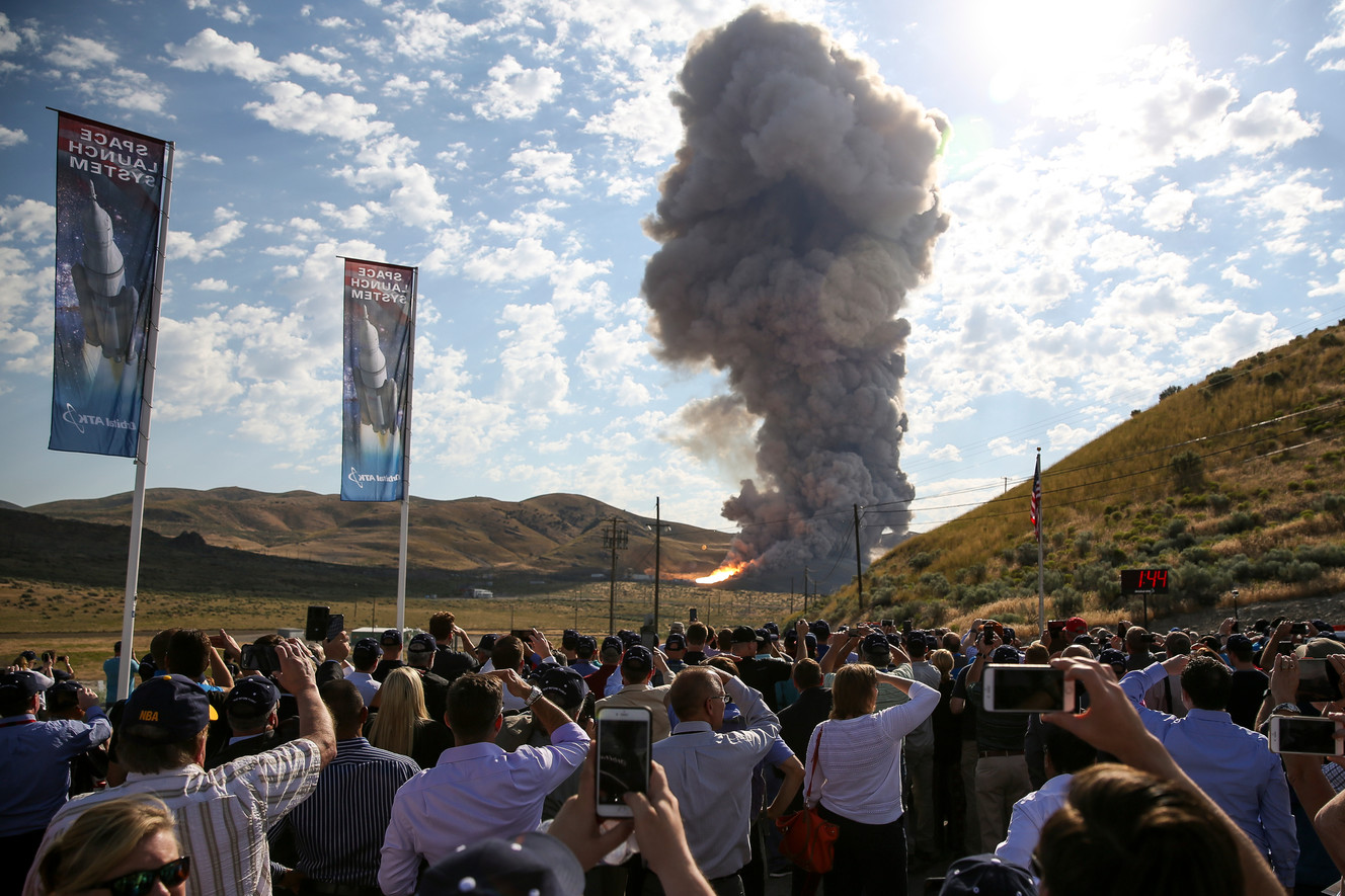 People watch a ground test of the five-segment rocket motor that will be used for NASA’s heavy-lift Space Launch System at the Orbital ATK facility in Promontory on Tuesday, June 28, 2016. (Photo: Spenser Heaps, Deseret News)