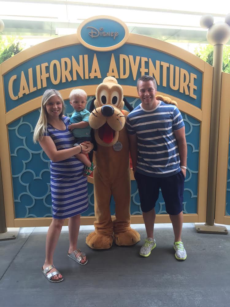 University of Utah football player Andy Phillips with his wife Megan and son Max at Disney's California Adventure with Pluto. (Photo: Courtesy: Phillips family)