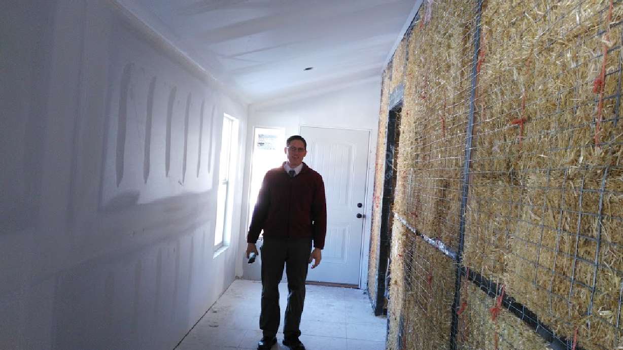 Frustrated with heating bills, Utahn builds straw bale house