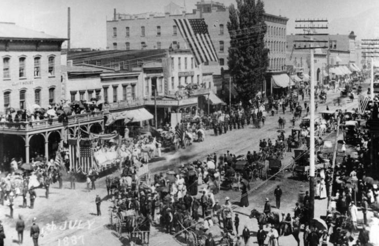 A photo of a Salt Lake City Independence Day celebration in 1887. The photo was taken from 3rd South and is looking north at Main Street. (Photo: Utah State Historical Society)