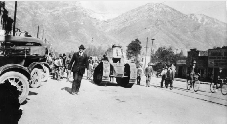 Abraham O. Smoot III marches beside a World War I tank during a 1918 Independence Day parade in Provo. (Photo: Utah State Historical Society)