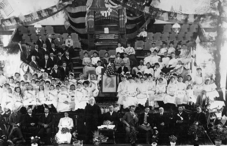 A 1904 Independence Day celebration at the Sevier Stake Tabernacle in Richfield. Utah Governor Heber M. Wells is standing in front on the stage. (Photo: Utah State Historical Society)