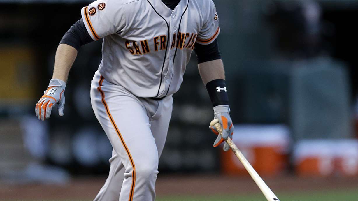 Bumgarner pitches Giants to win and swings the bat, too