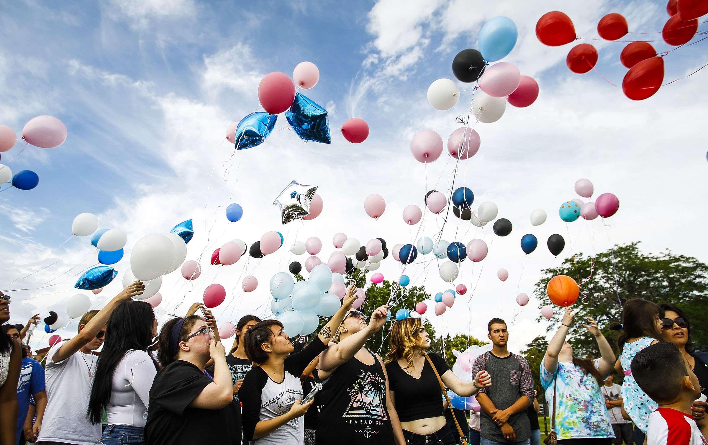 Family and friends of the Haan and Christianson's family lets go of balloons during a vigil in Roy on Friday, July 1, 2016. The vigil was for Tyler Christianson, 19, and Maddison Haan, 20, who died while driving after being hit by Marilee Patricia Gardner, 16, who was going 100 mph and attempting to commit suicide. (Photo: Weston Kenney, Deseret News)