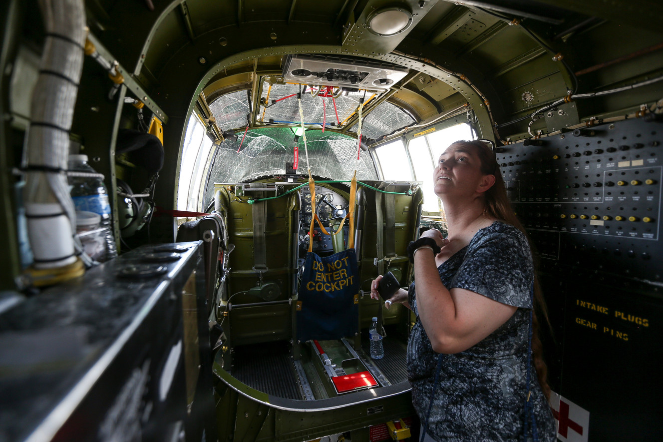 Raeleen Maxfield checks out the inside of a B-25 Mitchell bomber at the Provo Municipal Airport on Saturday, July 2, 2016. (Photo: Spenser Heaps, Deseret News)