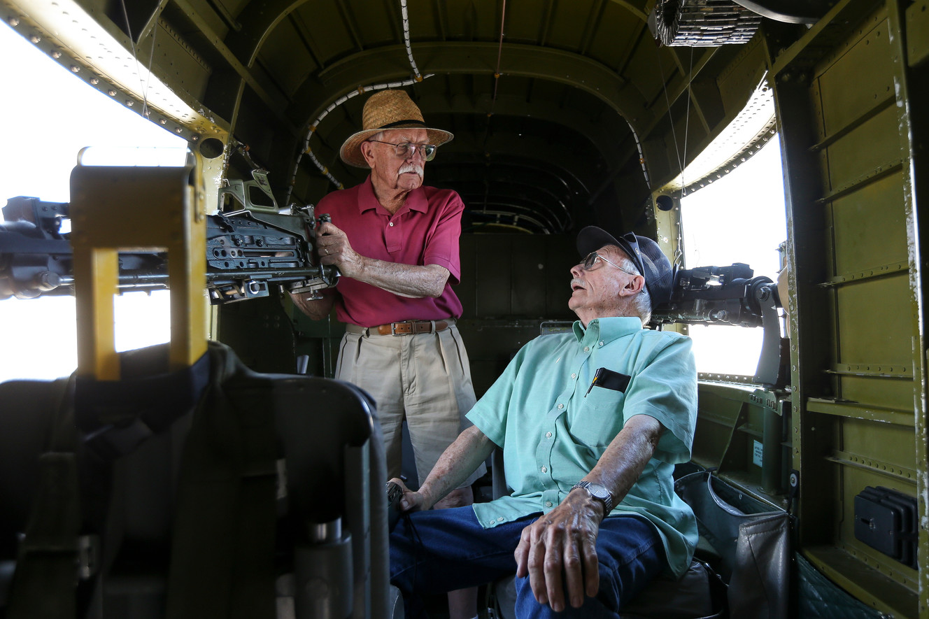 Brothers John Belmont, left, and Steve Belmont, right, check out the inside of a B-25 Mitchell bomber on display at the Provo Municipal Airport on Saturday, July 2, 2016. (Photo: Spenser Heaps, Deseret News)