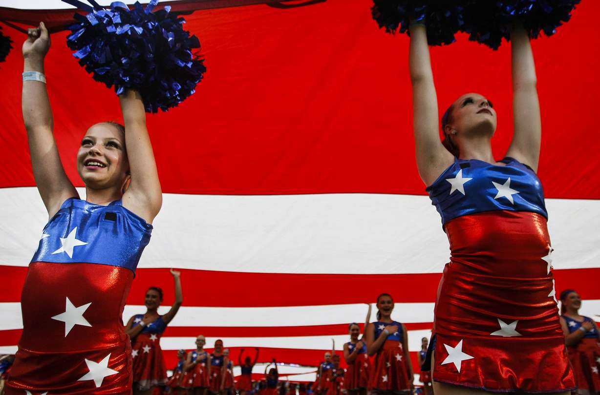 Performers hold up the American flag at 36th annual Stadium of Fire at Lavell Edwards Stadium in Provo on Saturday, July 2, 2016. (Photo: Weston Kenney, Deseret News)