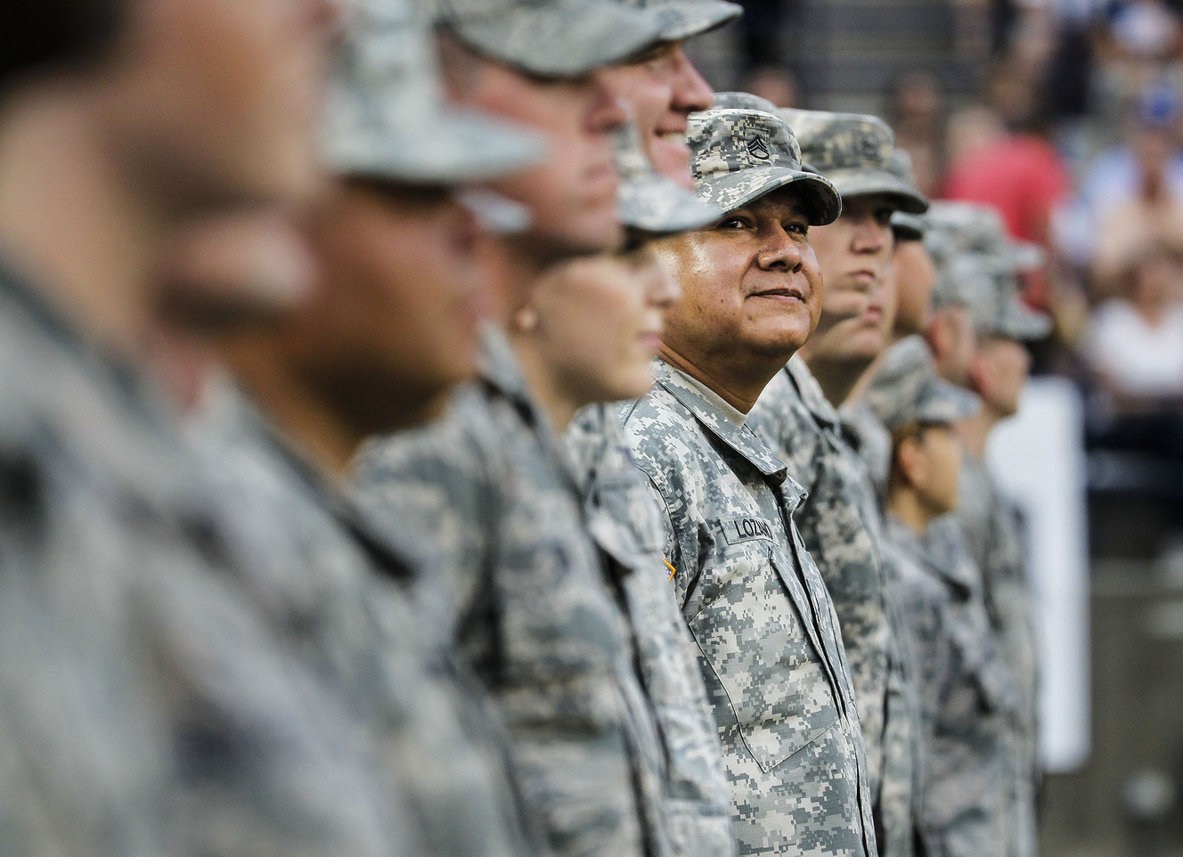 Women and men of the military stand on the field at 36th annual Stadium of Fire at Lavell Edwards Stadium in Provo on Saturday, July 2, 2016. (Photo: Weston Kenney, Deseret News)