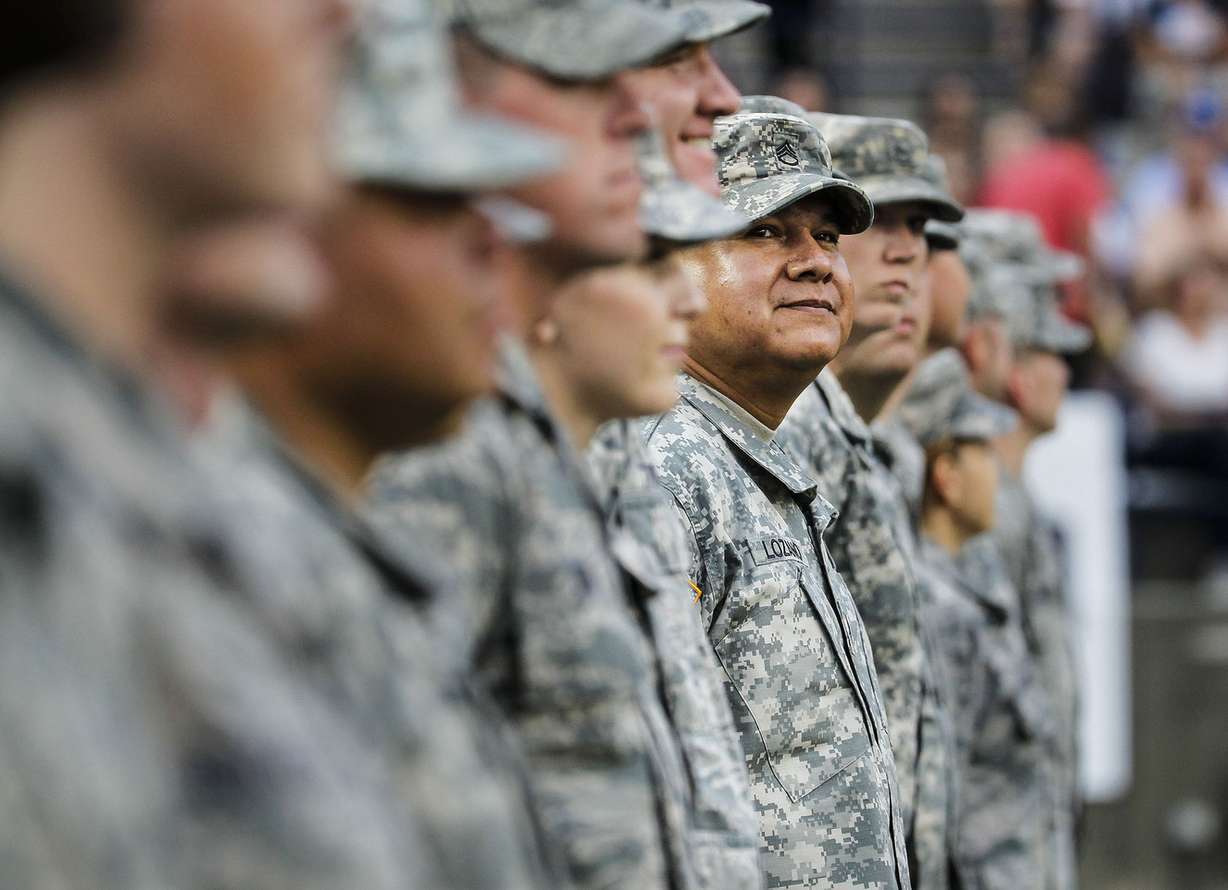 Women and men of the military stand on the field at 36th annual Stadium of Fire at Lavell Edwards Stadium in Provo on Saturday, July 2, 2016. (Photo: Weston Kenney, Deseret News)
