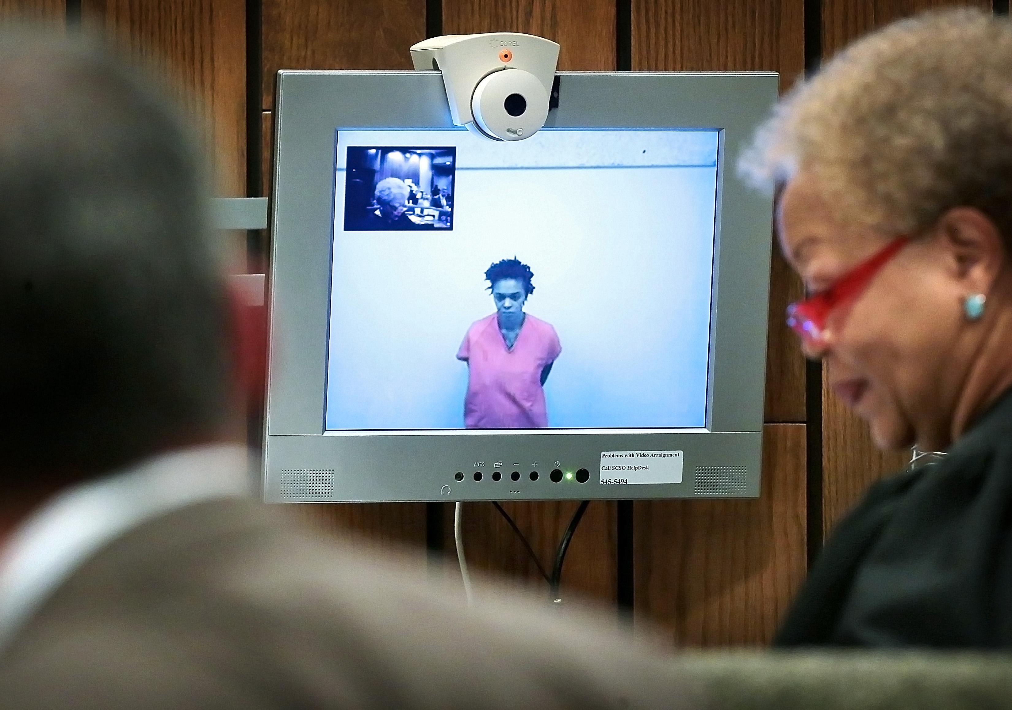 The Latest: Mom charged in kids' deaths taken to institute