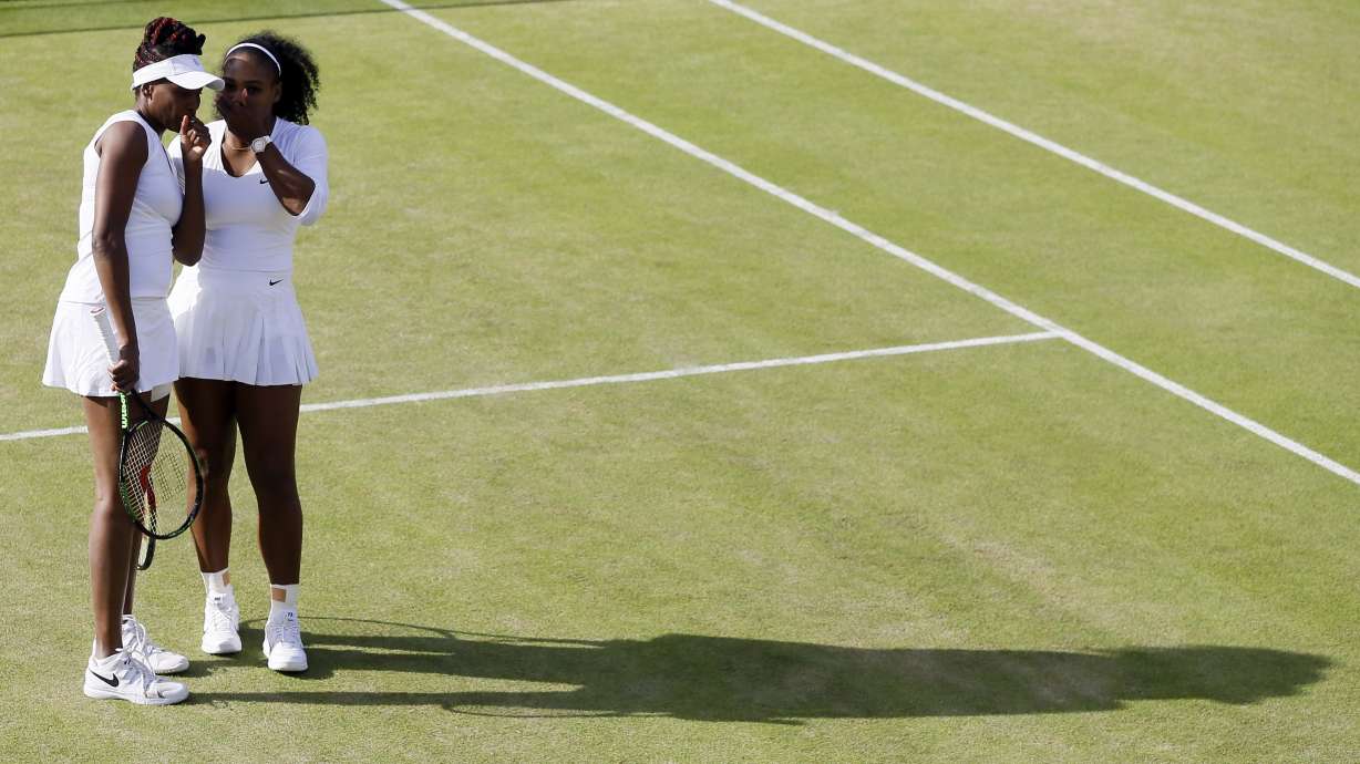The Latest: Williams sisters advance to doubles semifinals