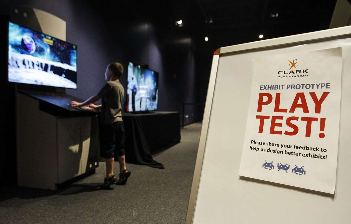 Jackson Cook, 4, plays a new interactive game at the Clark Planetarium in Salt Lake City on Thursday, July 7, 2016. (Photo: Weston Kenney, Deseret News)