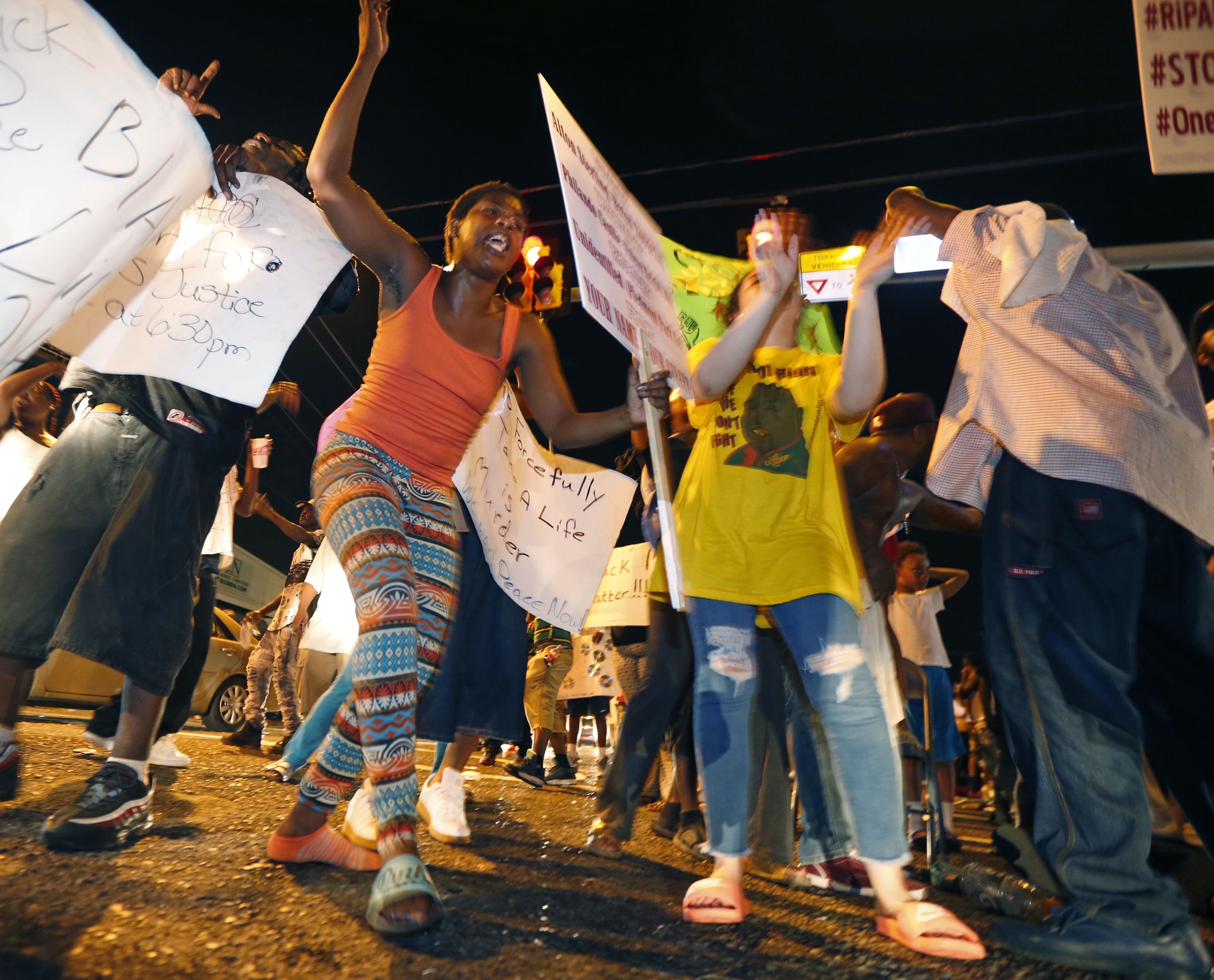 The Latest: Protesters gather outside police headquarters