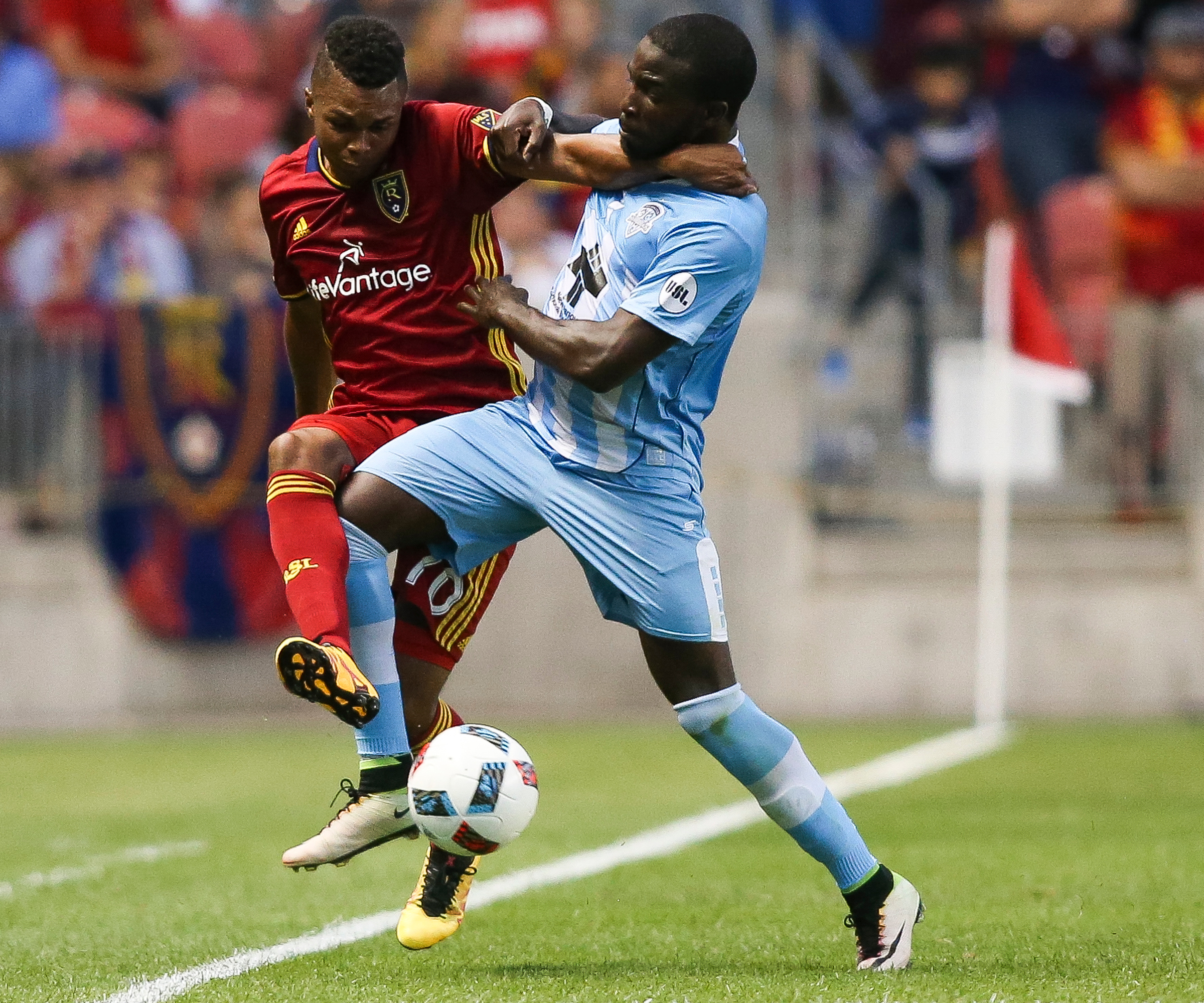 Real Salt Lake midfielder Jordan Allen (70) tries to keep the ball in as he's pushed out by Wilmington defender Peabo Doue (3) during a U.S. Open Cup game at Rio Tinto Stadium in Sandy on Tuesday, June 14, 2016. (Photo: Spenser Heaps/Deseret News)