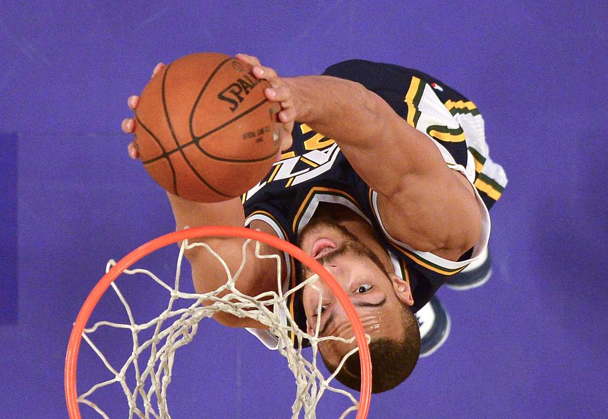 Utah Jazz center Rudy Gobert, of France, dunks during the first half of an NBA basketball game against the Los Angeles Lakers, Sunday, Jan. 10, 2016, in Los Angeles. (AP Photo/Mark J. Terrill)