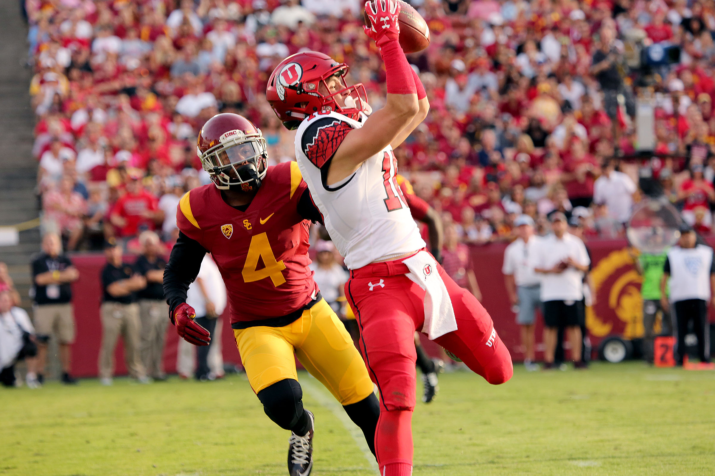 Utah Utes wide receiver Britain Covey (18) catches a pass over USC Trojans safety Chris Hawkins (4) and runs for a touchdown as the University of Utah is defeated by USC 42-24 in PAC12 football Saturday, Oct. 24, 2015, in Los Angeles. (Photo: Chase Campbell/Deseret News)