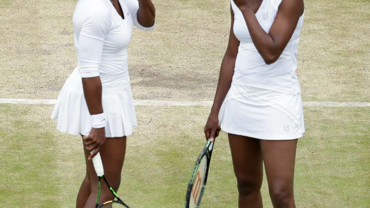 The Latest: Williams sisters win Wimbledon 6th doubles title