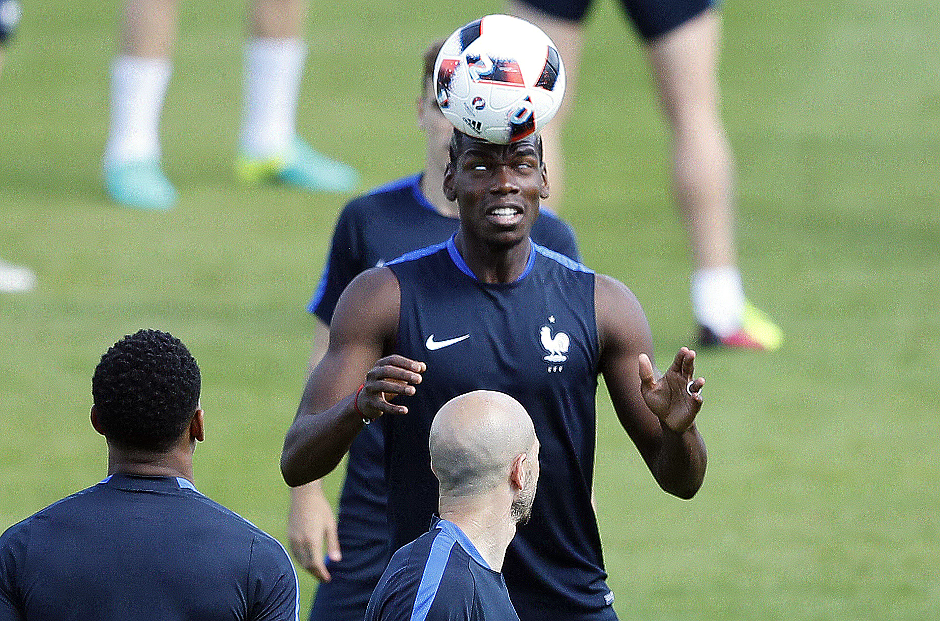 The Latest: Clouds of moths flying round Stade de France