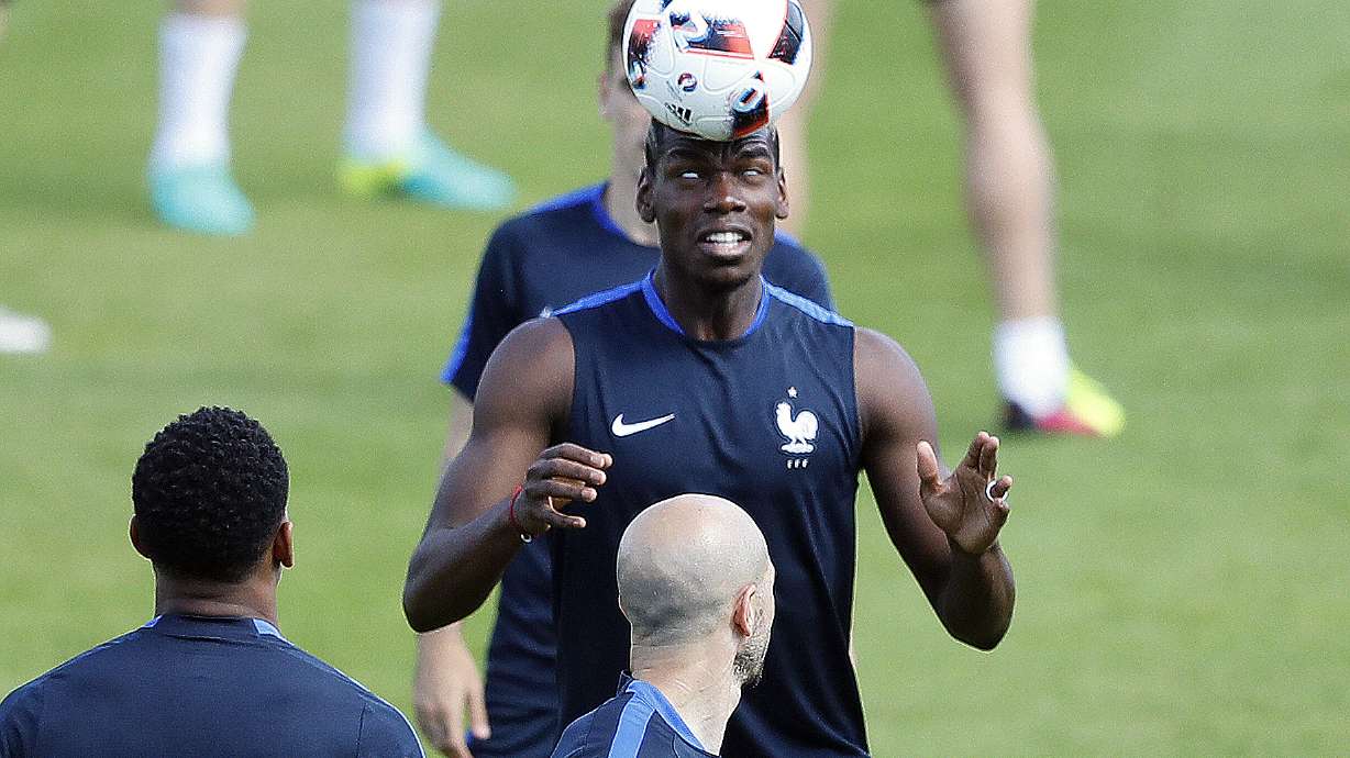 The Latest: Clouds of moths flying round Stade de France