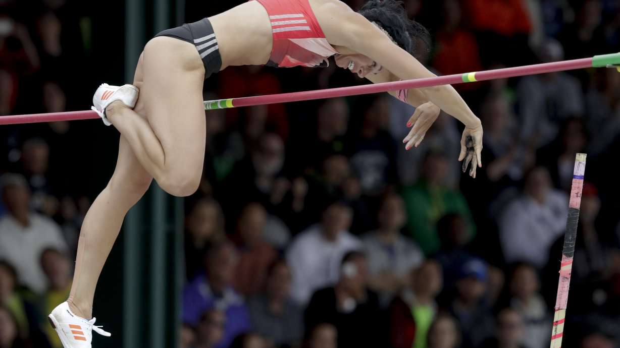 The Latest: Douglas fighting for spot on gymnastics team