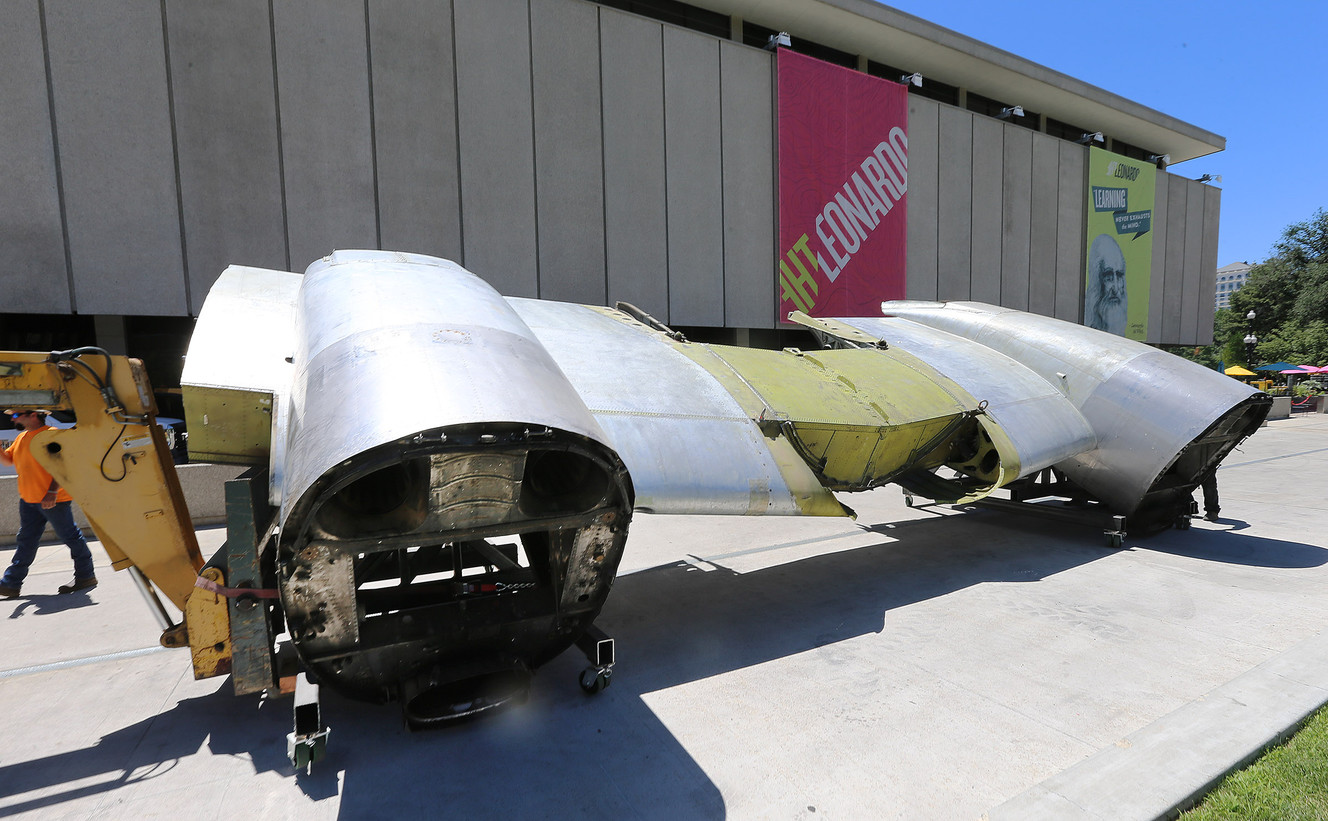 Workers use a crane to lift a section of a C-131 airplane at The Leonardo in Salt Lake City on Monday, July 11, 2016. The airplane is part of the museum's Flight exhibit that opens in August. (Photo: Scott G Winterton, Deseret News)