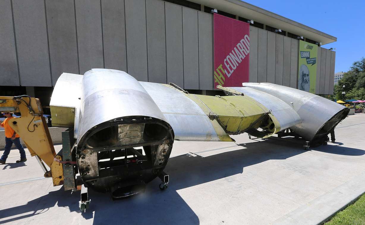 Workers use a crane to lift a section of a C-131 airplane at The Leonardo in Salt Lake City on Monday, July 11, 2016. The airplane is part of the museum's Flight exhibit that opens in August. (Photo: Scott G Winterton, Deseret News)