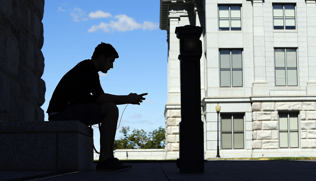 Austin Batchelor plays Pokemon Go at the Capitol in Salt Lake City on Monday, July 11, 2016. (Photo: Ravell Call, Deseret News)