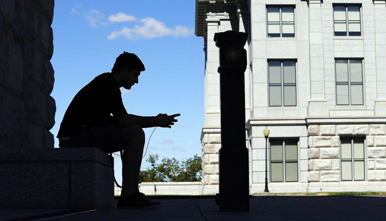Austin Batchelor plays Pokemon Go at the Capitol in Salt Lake City on Monday, July 11, 2016. (Photo: Ravell Call, Deseret News)