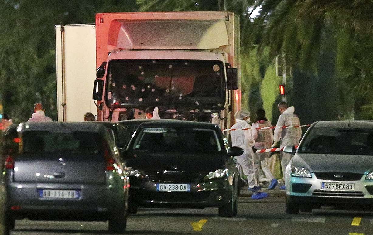 The truck which slammed into revelers late Thursday, July 14, is seen near the site of an attack in the French resort city of Nice, southern France, Friday, July 15, 2016. (AP Photo/Luca Bruno)