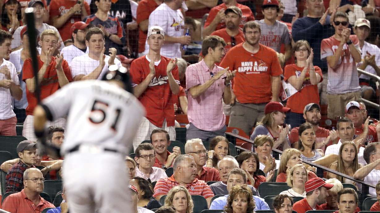Suzuki does his piece in Marlins' 7-6 win over Cardinals