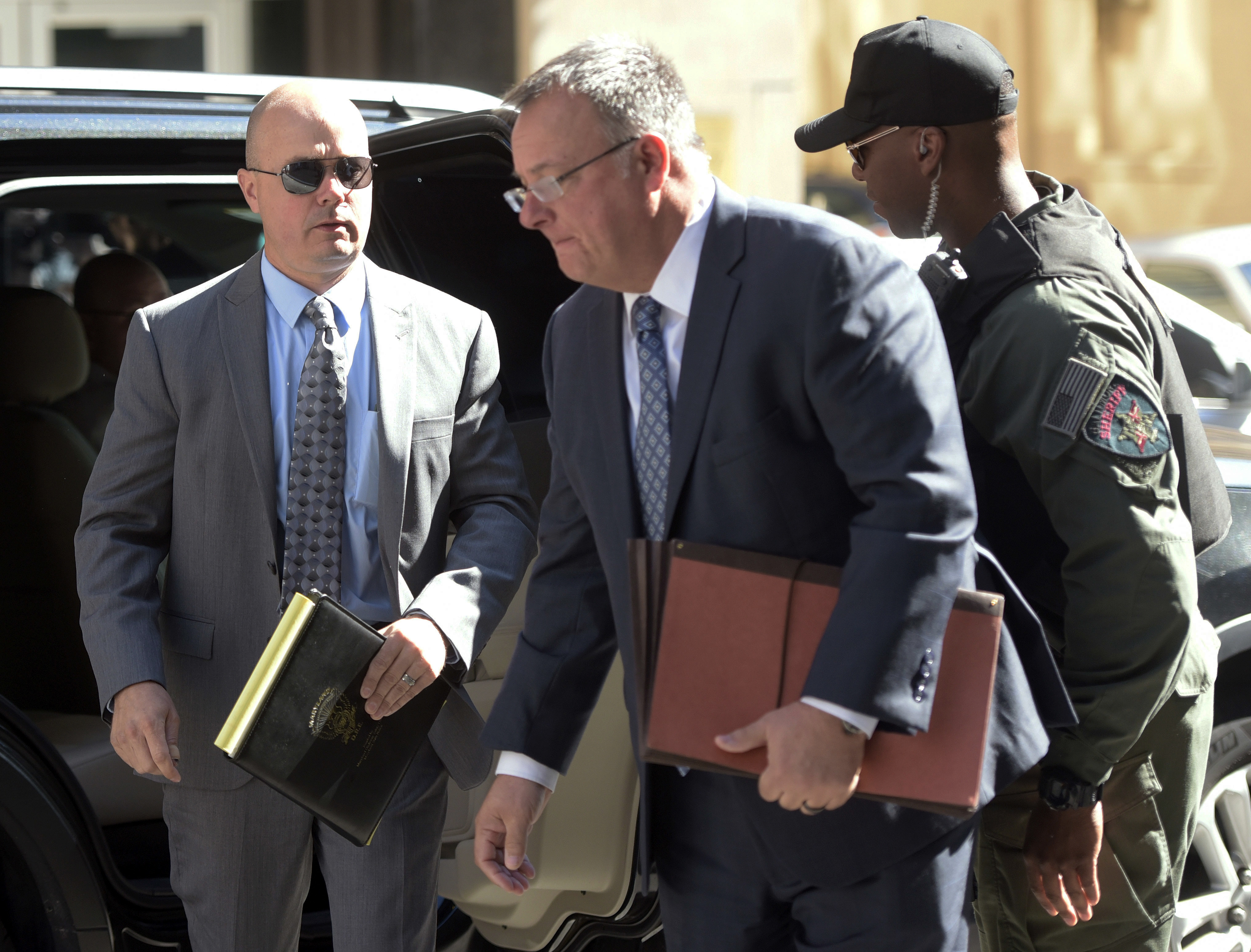 The Latest: Hogan doesn't see point of more officer trials