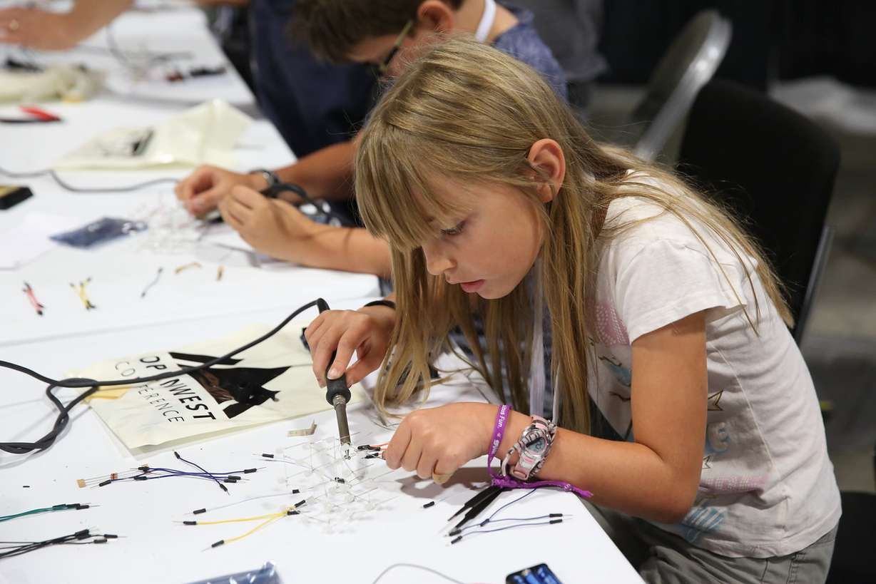 A youth participant at Open West creating an LED cube during the Young Technologists Session. (Photo: Bryant Livingston)