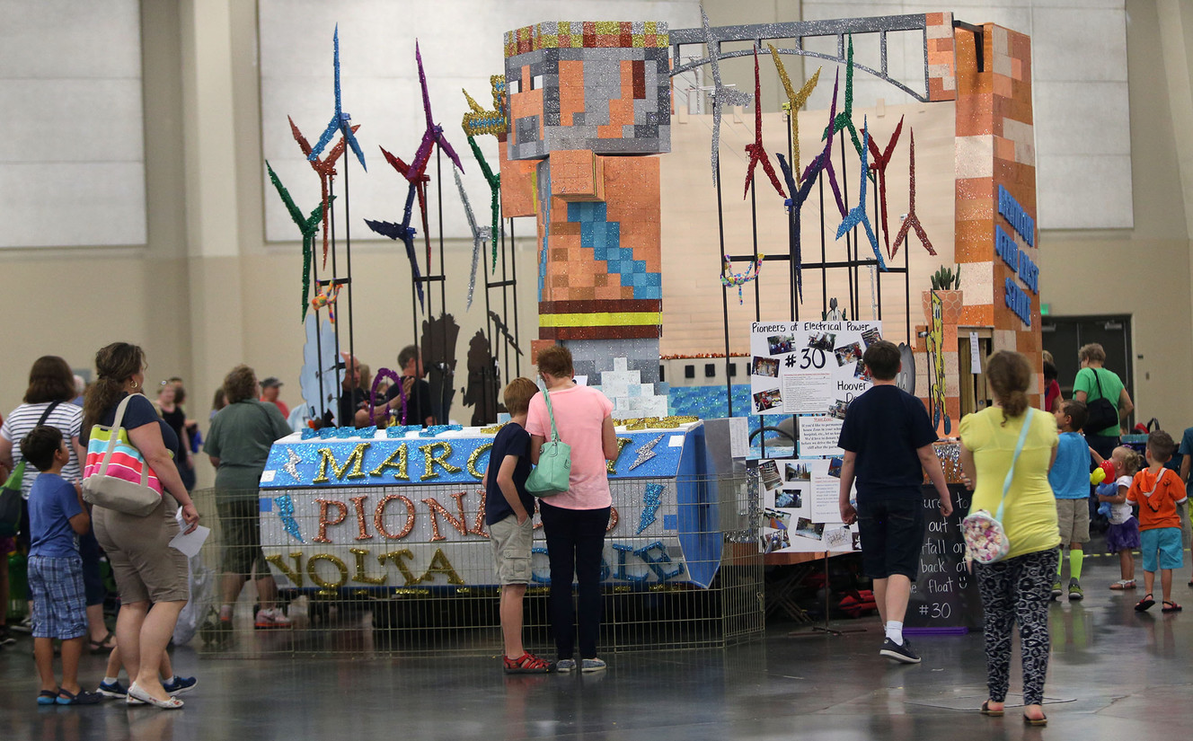 People check out the Days of '47 Bennion Utah East Stake float at the South Towne Expo Center in Sandy on Tuesday, July 19, 2016. The float's theme centers around Utah pioneers of electrical energy. (Photo: Kristin Murphy, Deseret News)