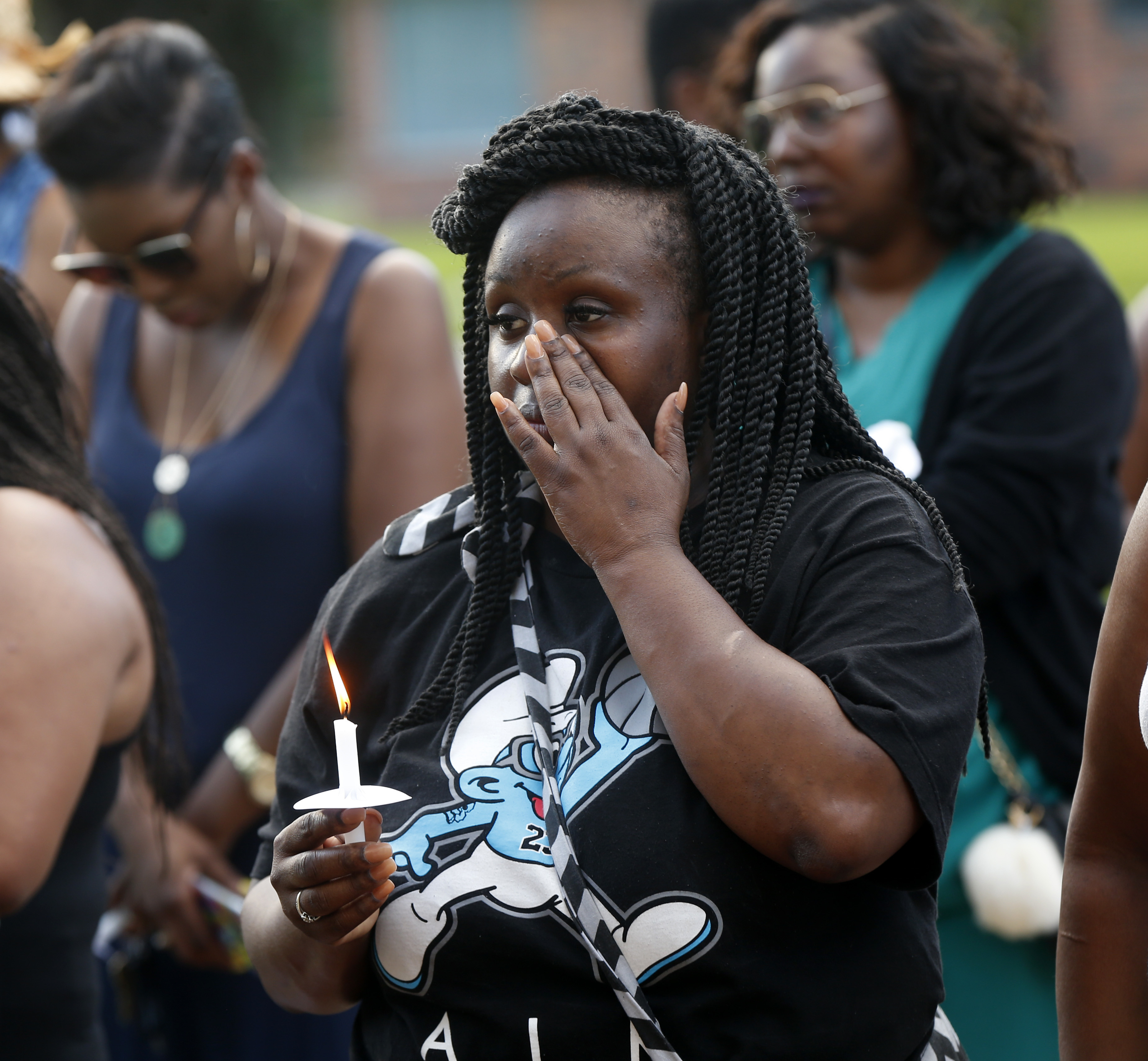 The Latest: 3rd officer was wounded when bullet grazed neck