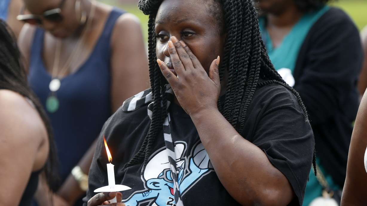 The Latest: 3rd officer was wounded when bullet grazed neck