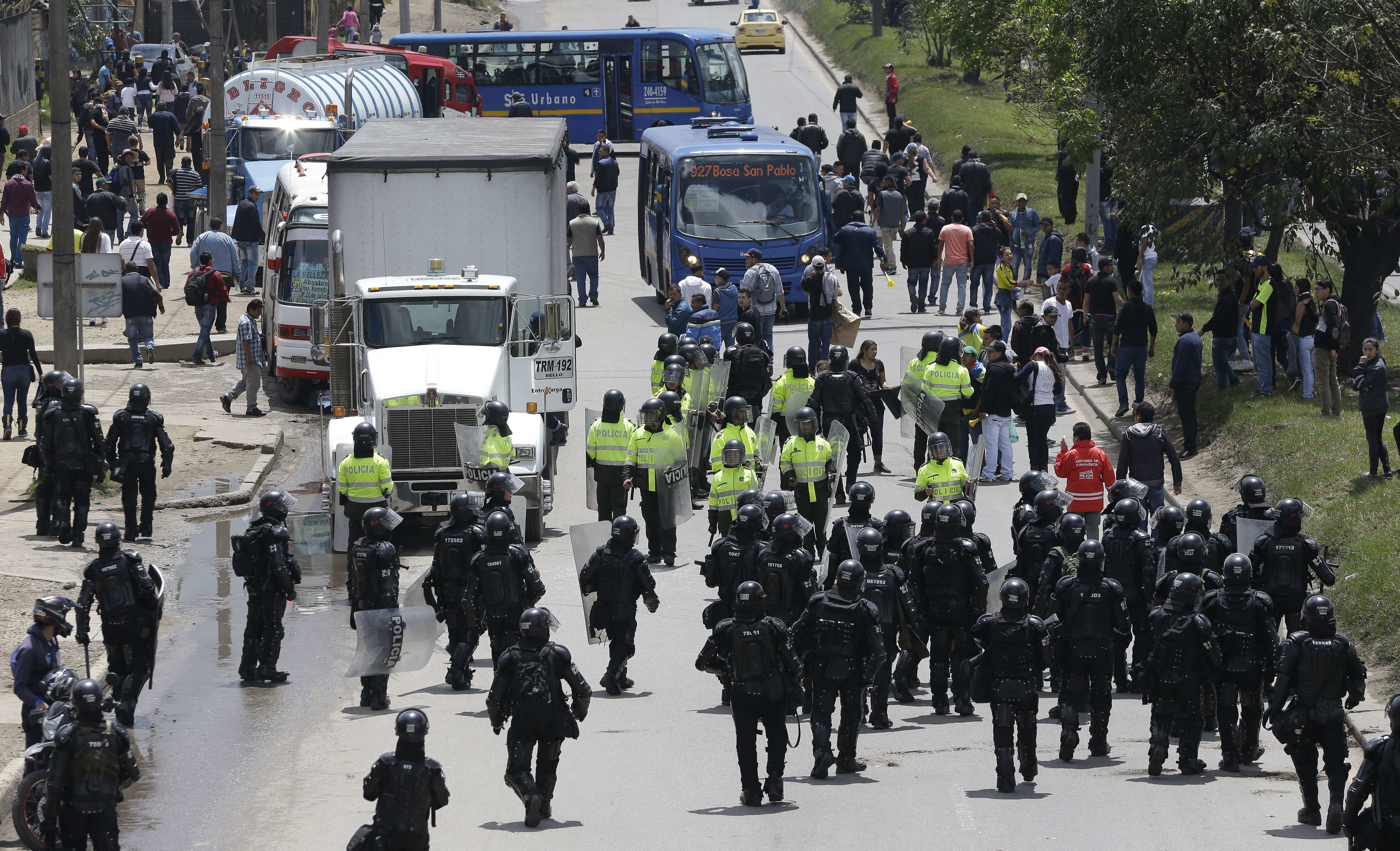 Striking truckers clash with police in Colombia's capital