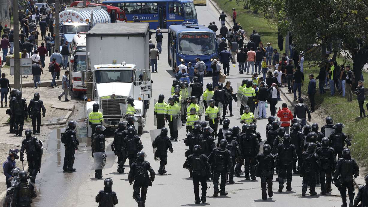Striking truckers clash with police in Colombia's capital