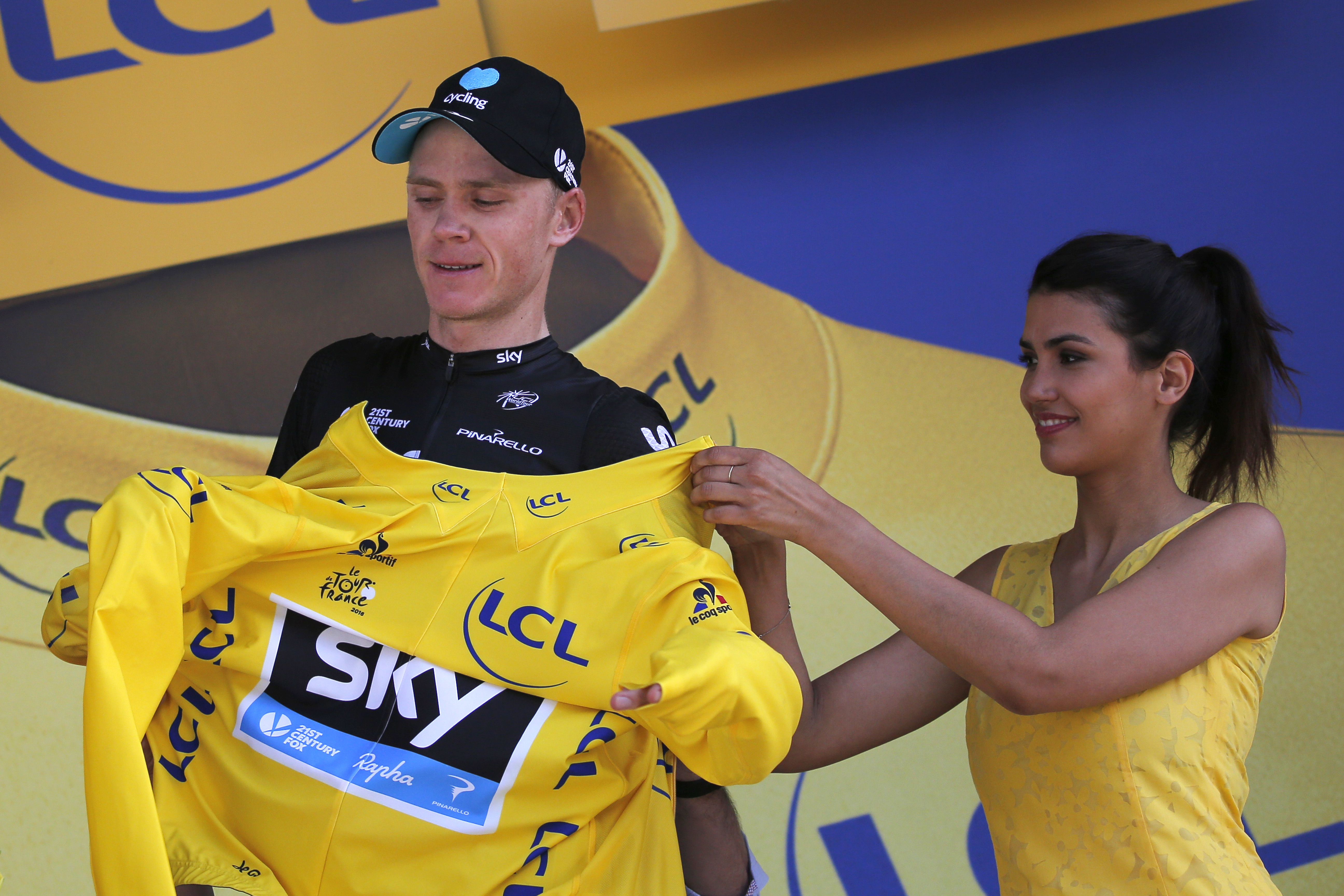 Froome wins mountain time trial, increases Tour lead