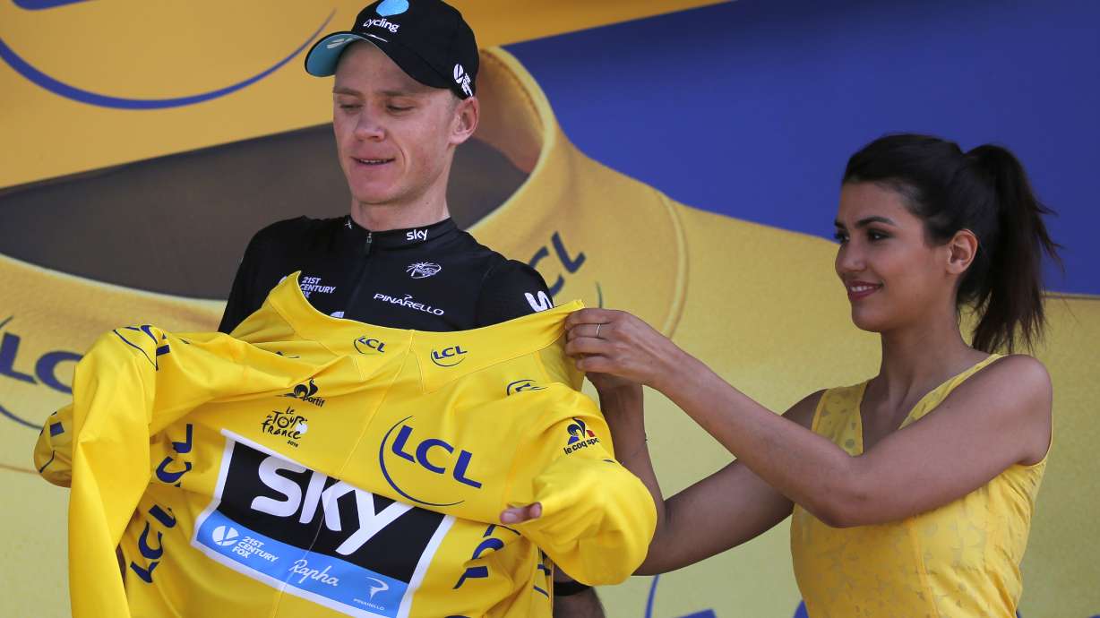 Froome wins mountain time trial, increases Tour lead